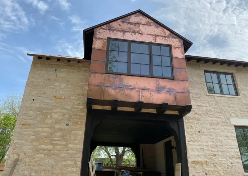 Copper metal panel facade on a stone building for Metal Roof Coating in Glen Burnie